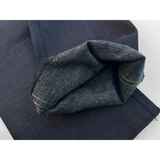 Open hem showing fabric's black melange weft