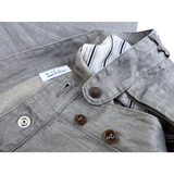 Detail of made in the USA Nouvelle Vague slacks button fly and snap button waistband.